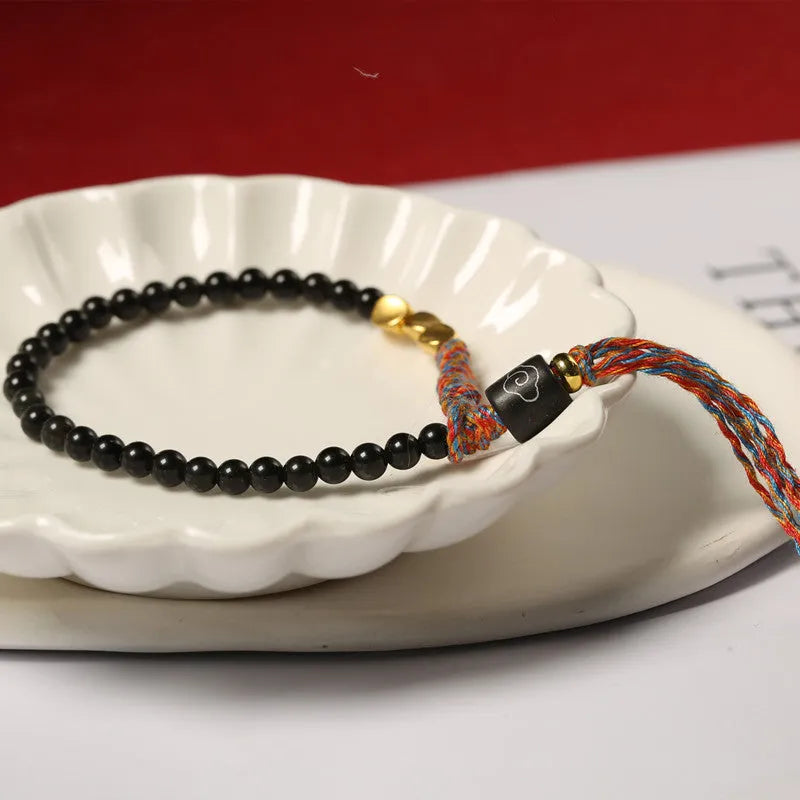Hand-woven obsidian colour bracelet with 4mm width and 15.5-16cm length shown as wearable accessory