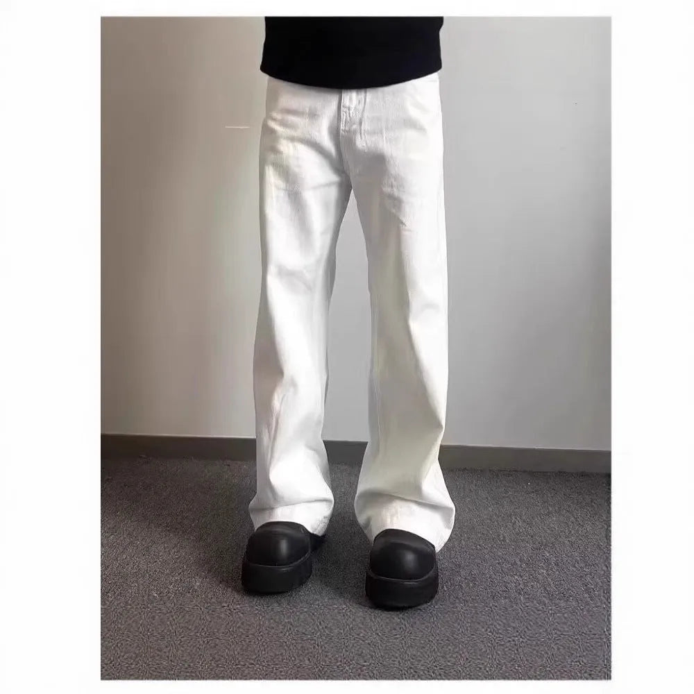 Men's white straight-leg wide-cut denim jeans on a plain background, showing front and side views.