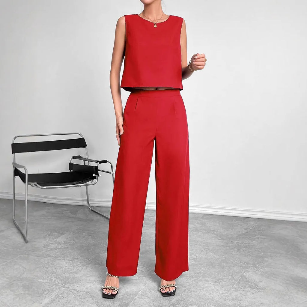 Red women's sleeveless top and wide leg pants two-piece co-ord set on a hanger.