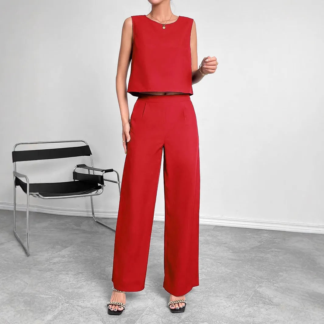 Red women's sleeveless top and wide leg pants two-piece co-ord set on a hanger.
