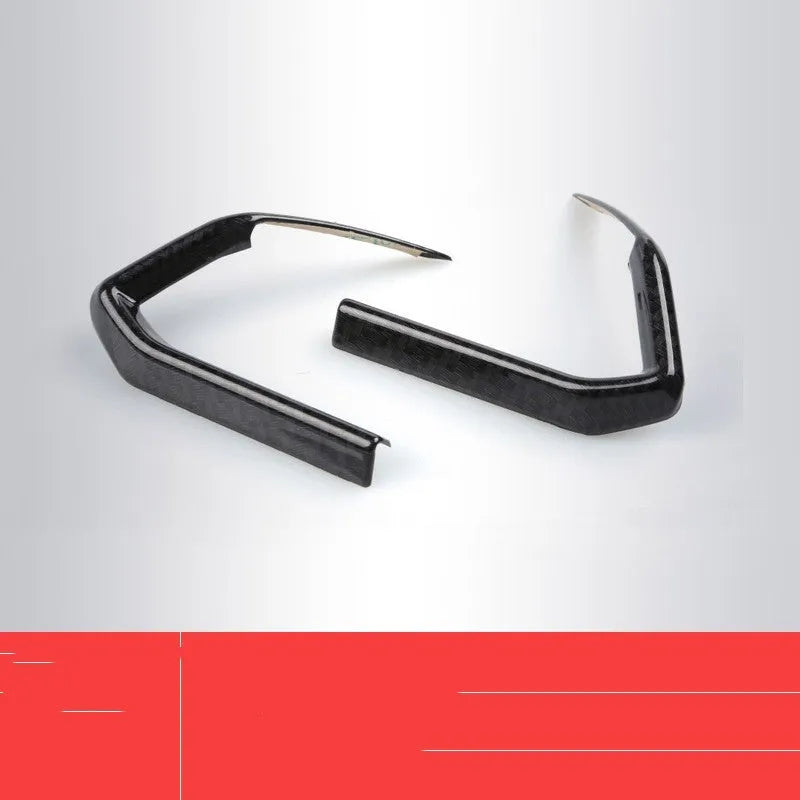 A pair of left and right carbon fibre pattern ABS plastic frames for car steering wheel decoration.