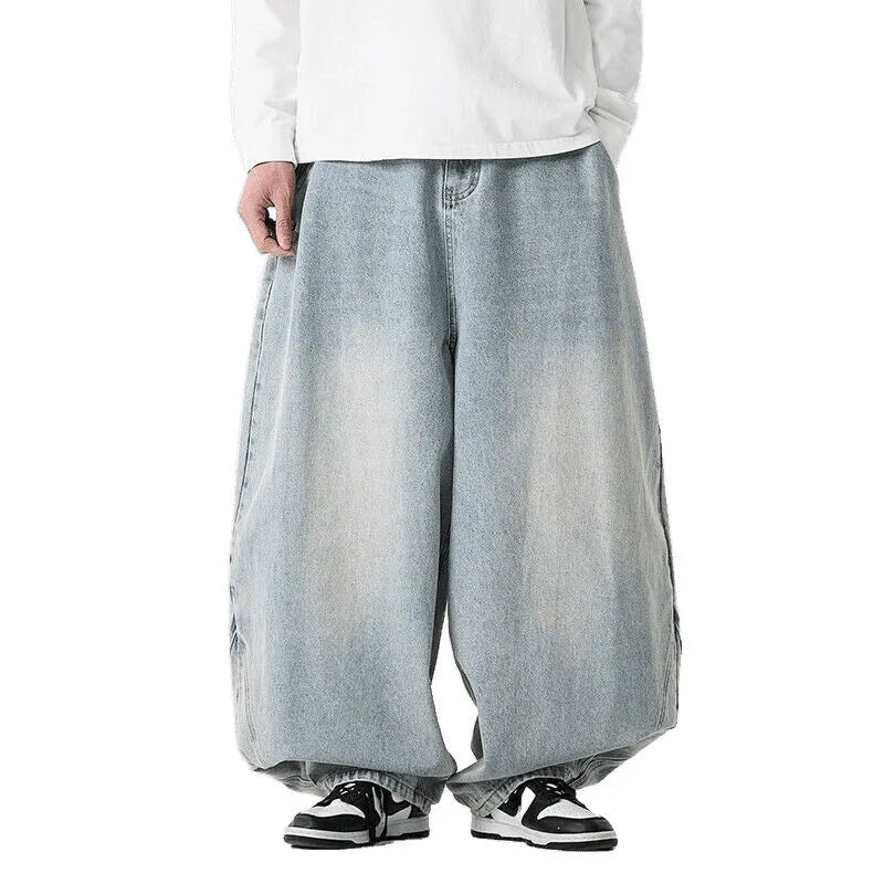 Men's plus size wide leg baggy jeans in black denim on a hanger