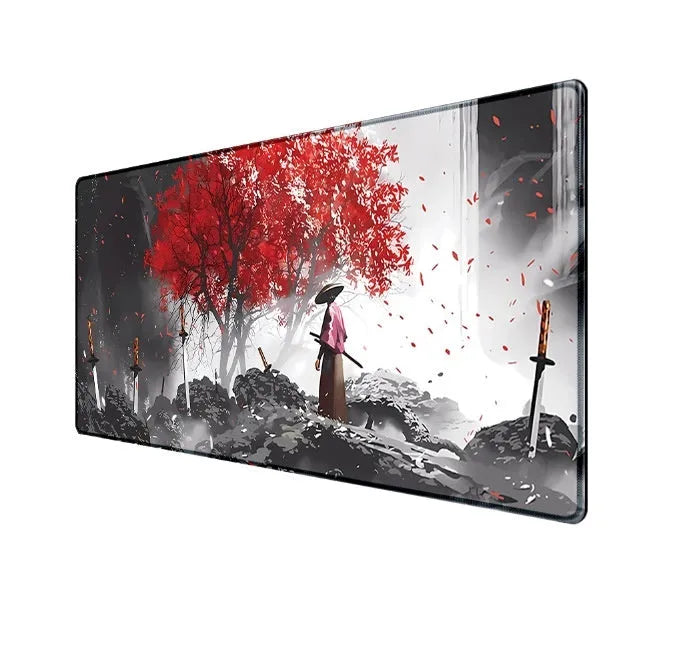 Japanese samurai artwork printed on a large black cloth gaming mouse pad on a wooden desk.