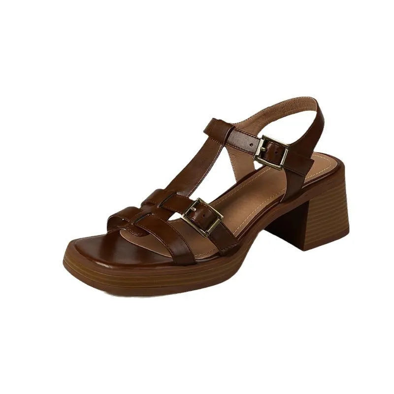 Black women's retro sandals with T-shaped buckle, open toe, chunky platform heel, and square toe shape.
