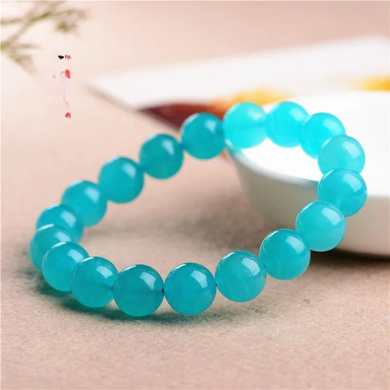 Natural amazonite scattered beads in blue-green ice colour showing polished surfaces and multiple size options