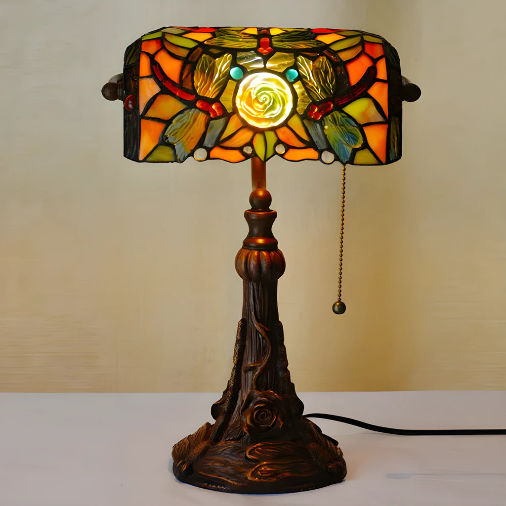 10-inch Tiffany stained glass table lamp with resin base on a desk.