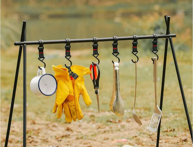 Large foldable aluminium alloy triangle frame camping drying rack with multiple hooks, shown with optional side hanger and top tray.