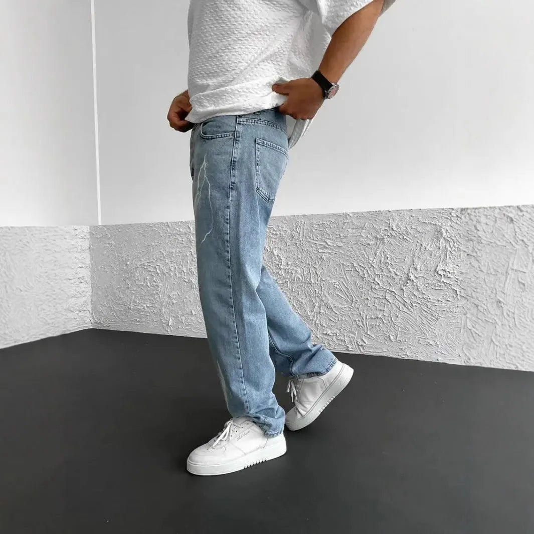 Men's blue straight-leg cotton denim jeans with loose fit and mid-waist design