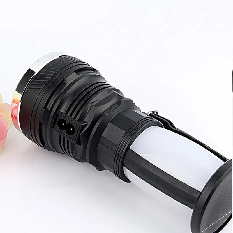 Black solar-panel and USB rechargeable LED flashlight for outdoor and emergency use.