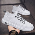 Men's casual white PU shoes with round toe and shallow mouth design on a flat sole.