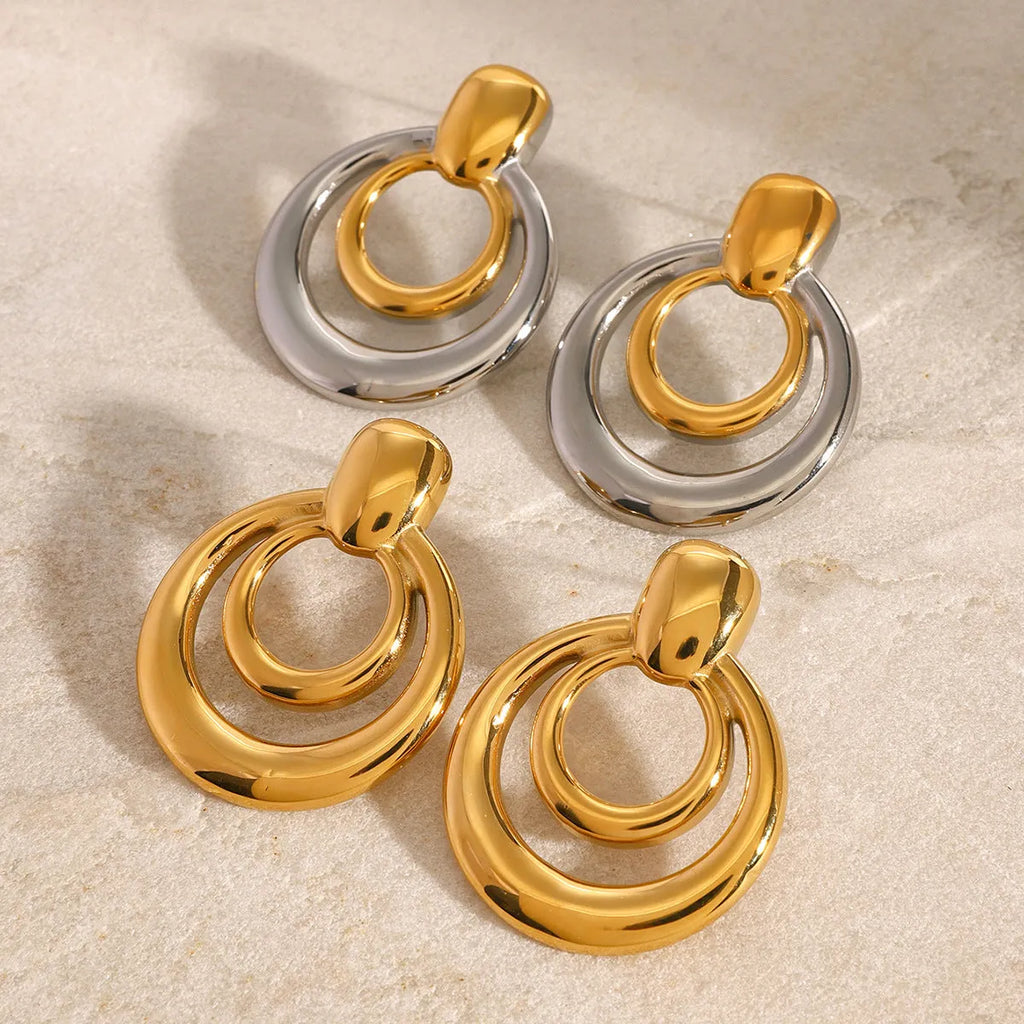 Golden round geometric stud earrings with double layer hollow design on titanium steel
