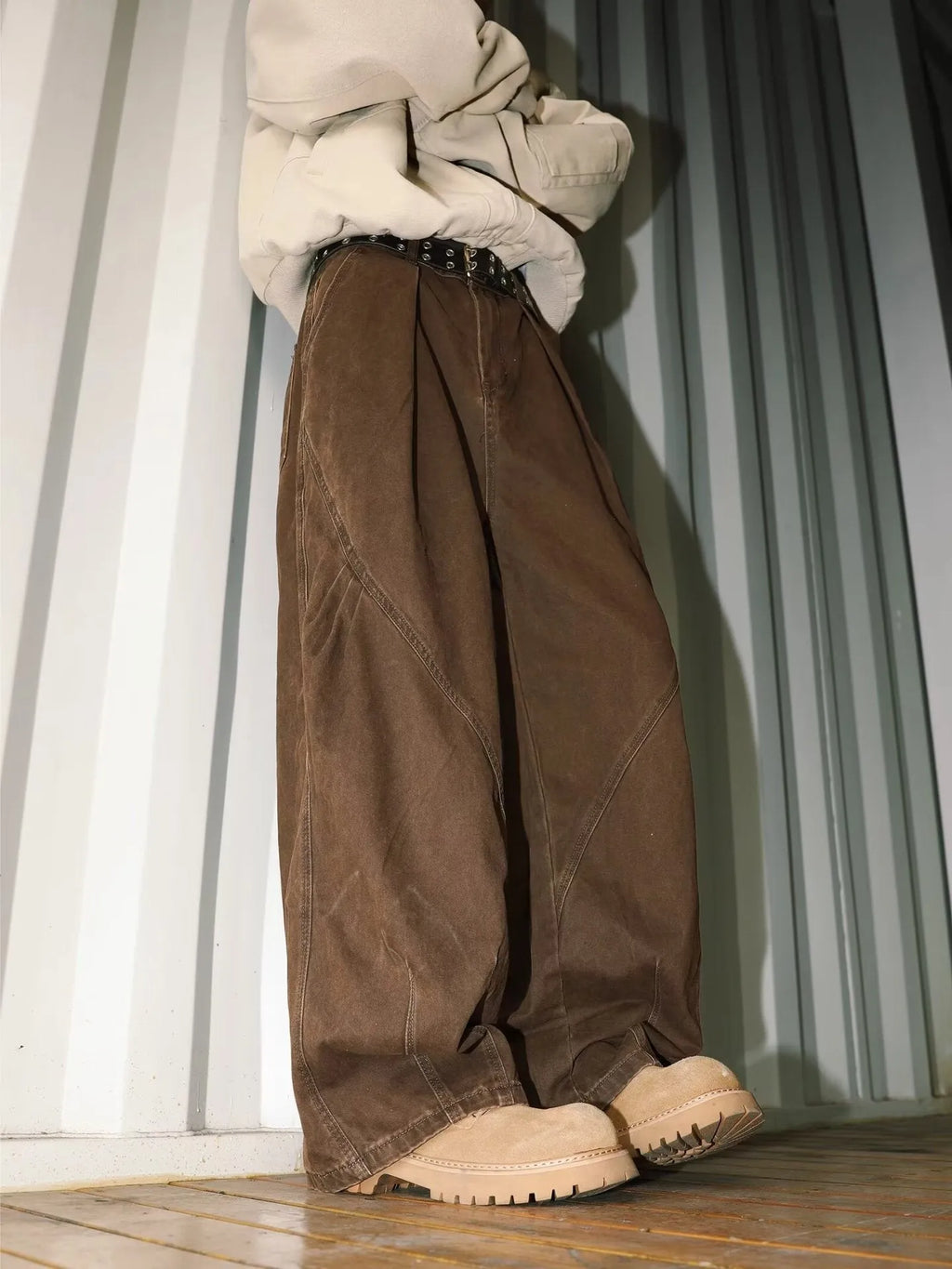 Men's pleated straight-leg trousers in a striped pattern, shown in apricot colour.