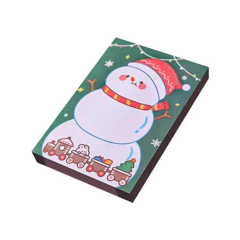 Christmas cartoon sticky notes pad with festive designs including Santa Claus and snowman