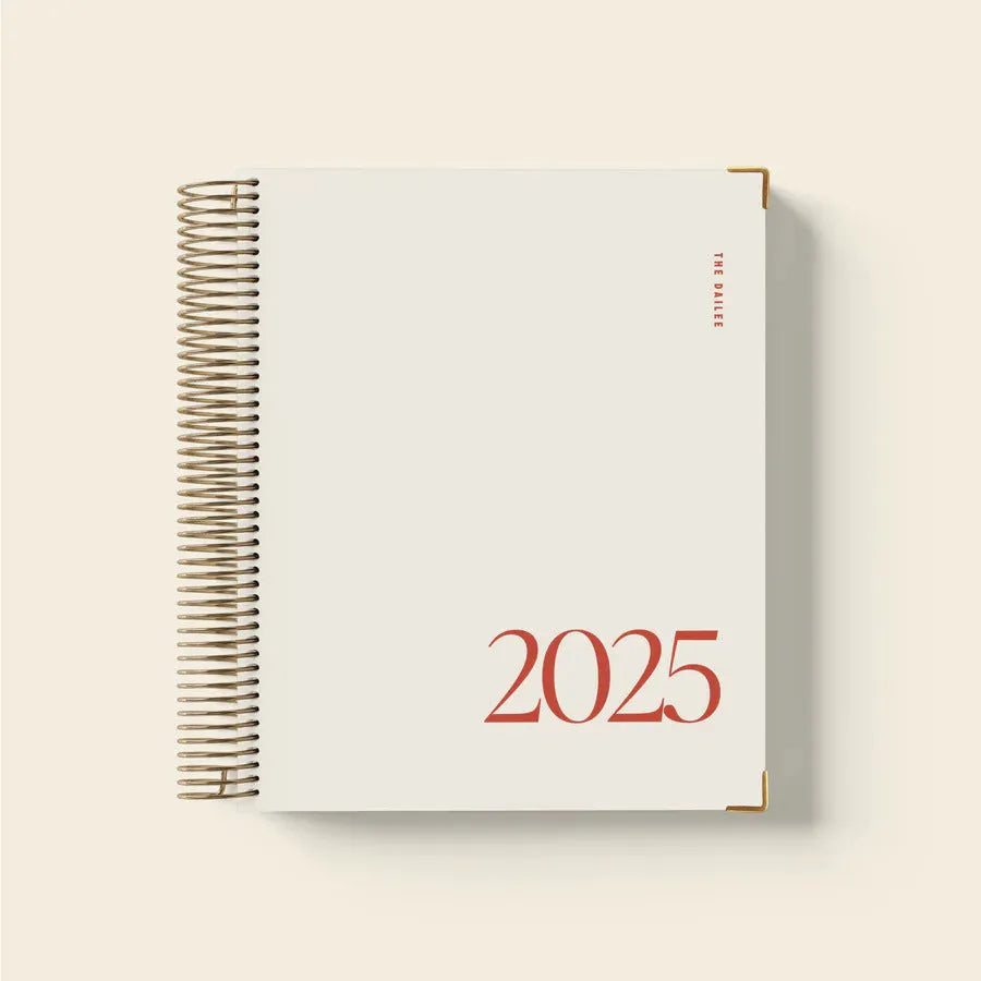 Cherry red spiral-bound daily schedule notebook with A5 size format and coil binding