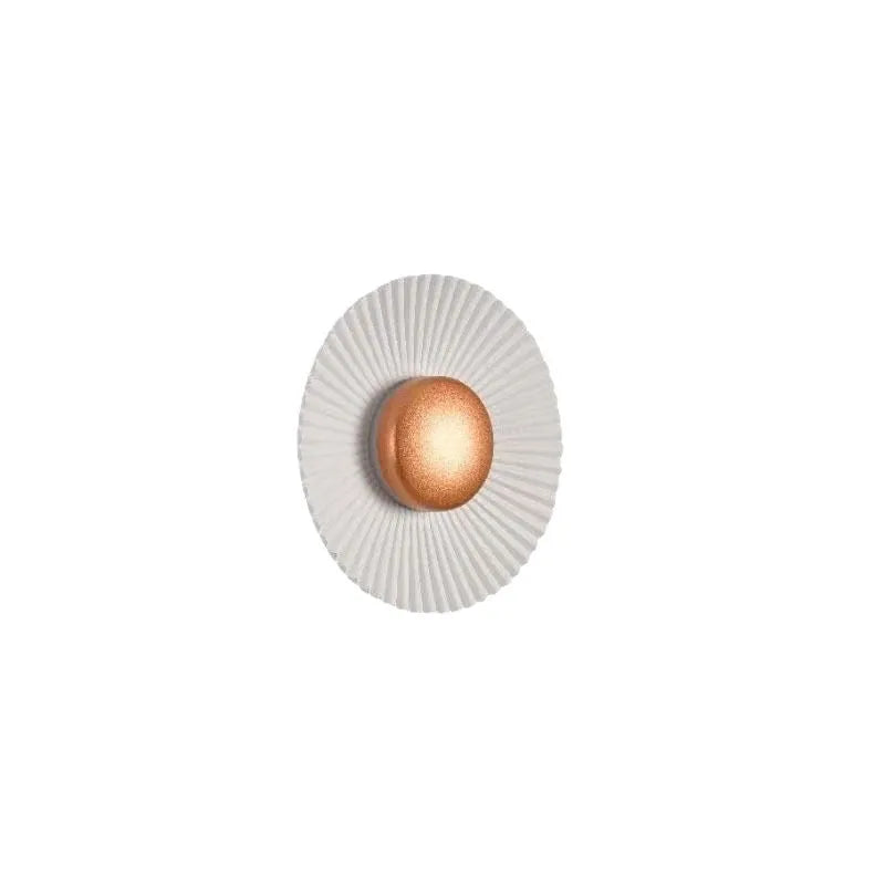 Round aluminium wall lamp mounted on a wall, showing LED illumination.