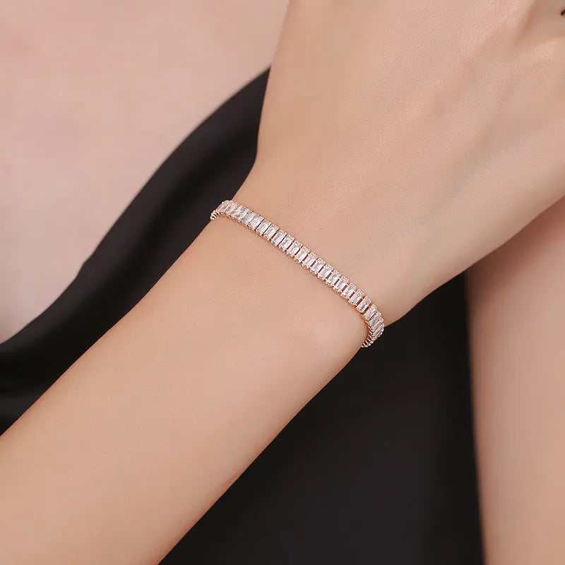 Rectangular brass bracelet with quadrilateral diamond pattern in gold or silver colour