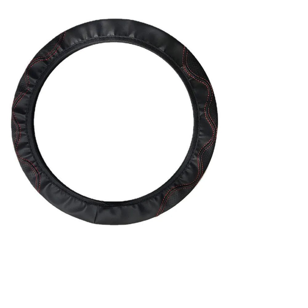 Embossed corrugated elastic steering wheel cover in black, shown fitted on a car steering wheel.