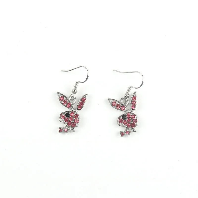 A pair of cartoon rabbit stud earrings with a full diamond design, shown in gold, pink, and silver colour options.