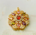 Close-up of a women's floral-shaped zircon pendant necklace in a gold electroplated finish, shown with a delicate chain.