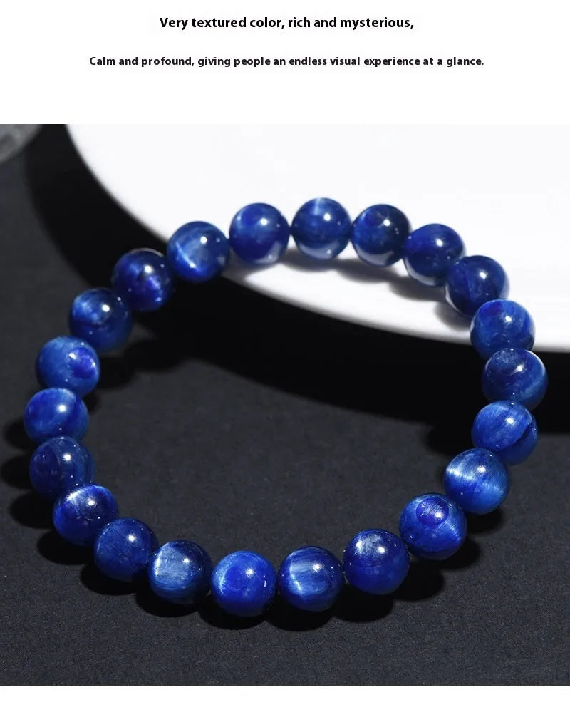 Blue crystal ball bracelet with geometric beads and Ruyi design elements on wrist