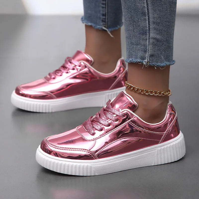Gold sequinned platform sneaker with round toe and thick MD sole on a white background