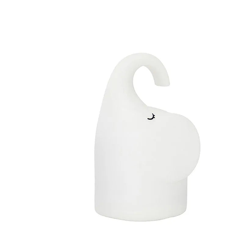 DOMI Elephant Silicone Night Light with warm LED lighting on bedside table