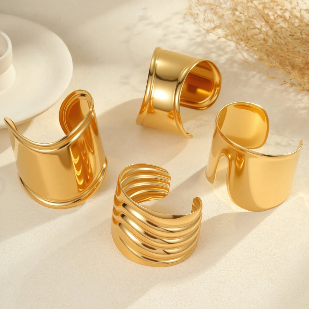 Women's fashion bracelet with exaggerated wide design and geometric wave pattern in gold plating