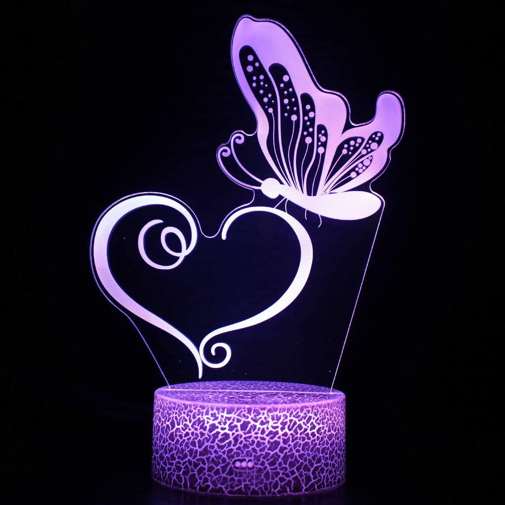 Small acrylic USB table lamp with touch control on a wooden desk.
