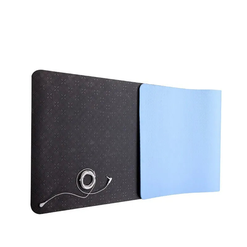 Blue conductive grounding yoga mat with plants pattern and integrated wire, 182cm long.
