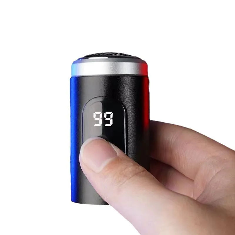 Black portable USB rechargeable electric shaver with LED display, shown with its cleaning brush and protective cover.