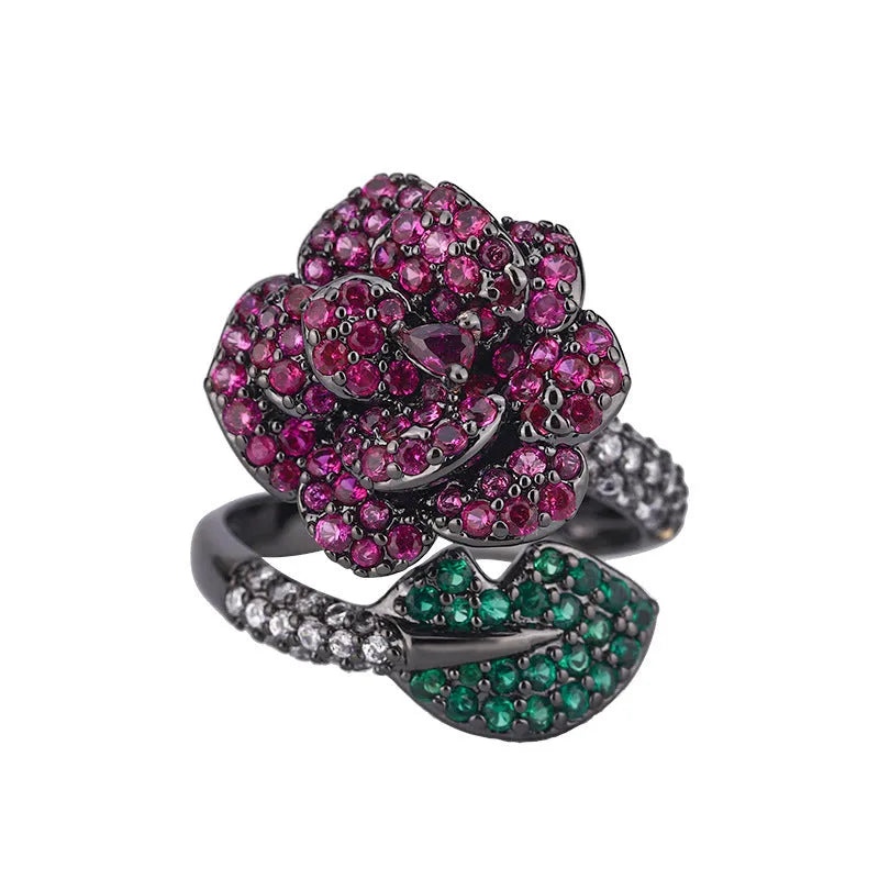 Black gold geometric flower personality ring with red corundum simulation stone on female hand
