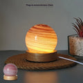 Planet-themed USB night light with modern design and three-colour dimming on included base