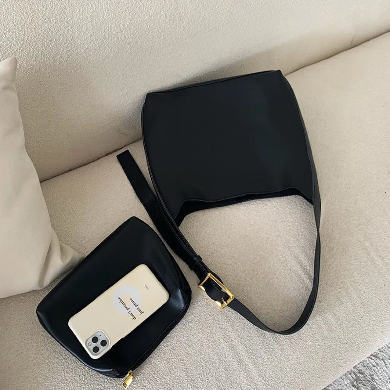 Women's soft PU shoulder bag with swing threads decoration in black and brown colour options