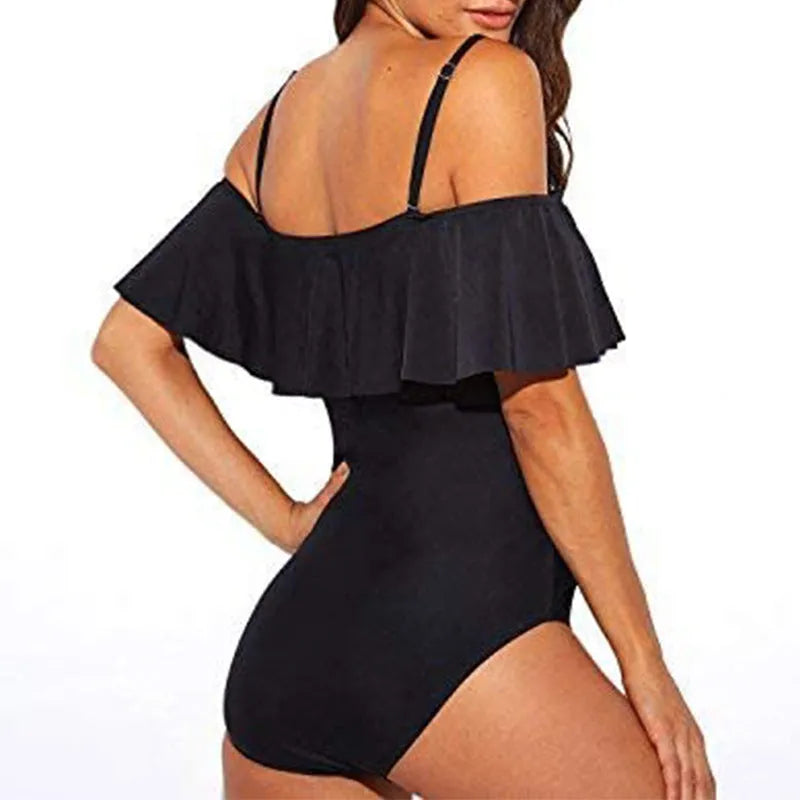 Black one-piece swimsuit with ruffled halter strap and side cut-out details