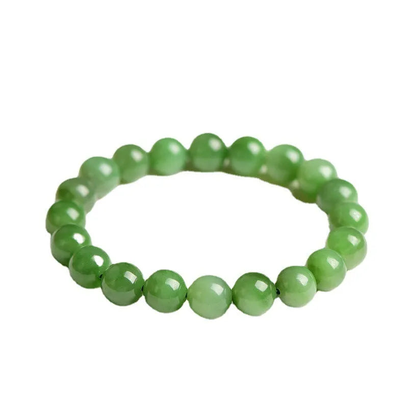 Natural Hetian jade jasper ball bracelet with polished beads on a wrist.