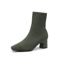 Women's knitted sock boots with chunky high heel and square toe, mid-calf length, shown in black