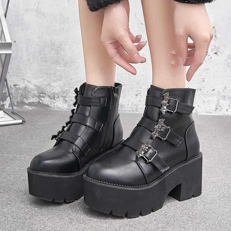 Black women's Harajuku punk ankle boots with a bat-shaped buckle and side zipper.