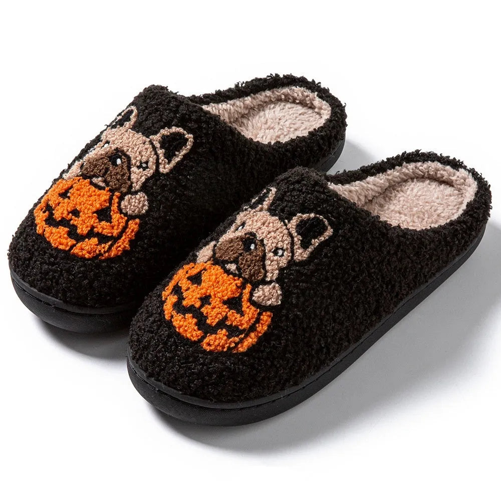 Black and white Halloween pumpkin plush slippers with TPR rubber soles in multiple sizes