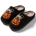 Black and white Halloween pumpkin plush slippers with TPR rubber soles in multiple sizes