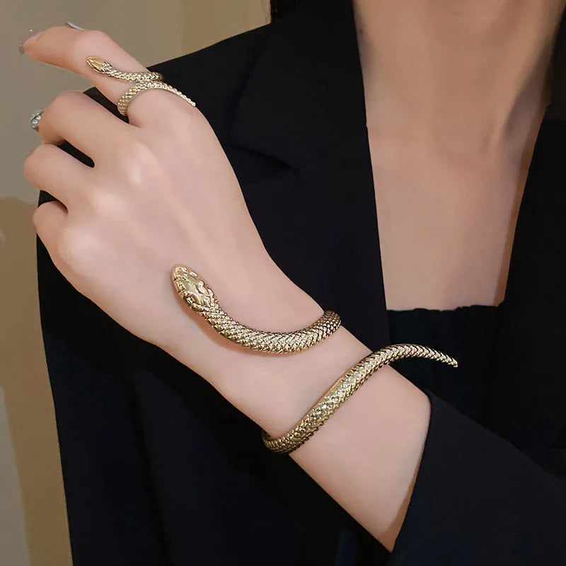 Gold tone simulated snake jewellery set with twisted winding ring and bracelet