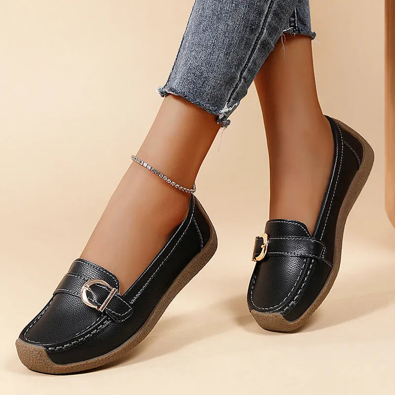 Women's beige casual flat loafers with round toe and slip-on design on a soft sole.