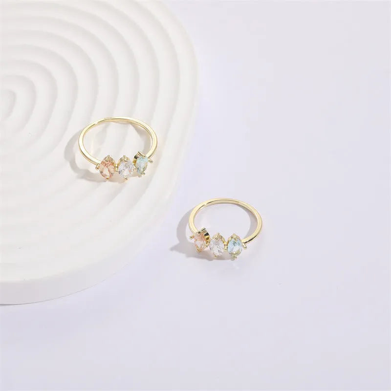 Geometric triangle birthstone ring with horse eye tricolour zircon in gold electroplated finish