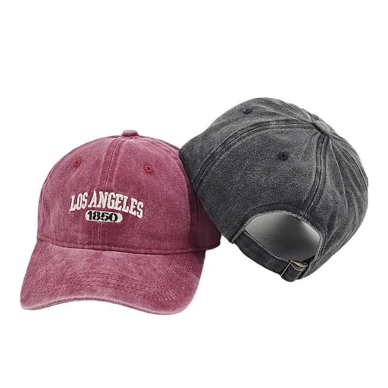 Personalised washed distressed embroidered peaked cap in acrylic fabric on adjustable head model.