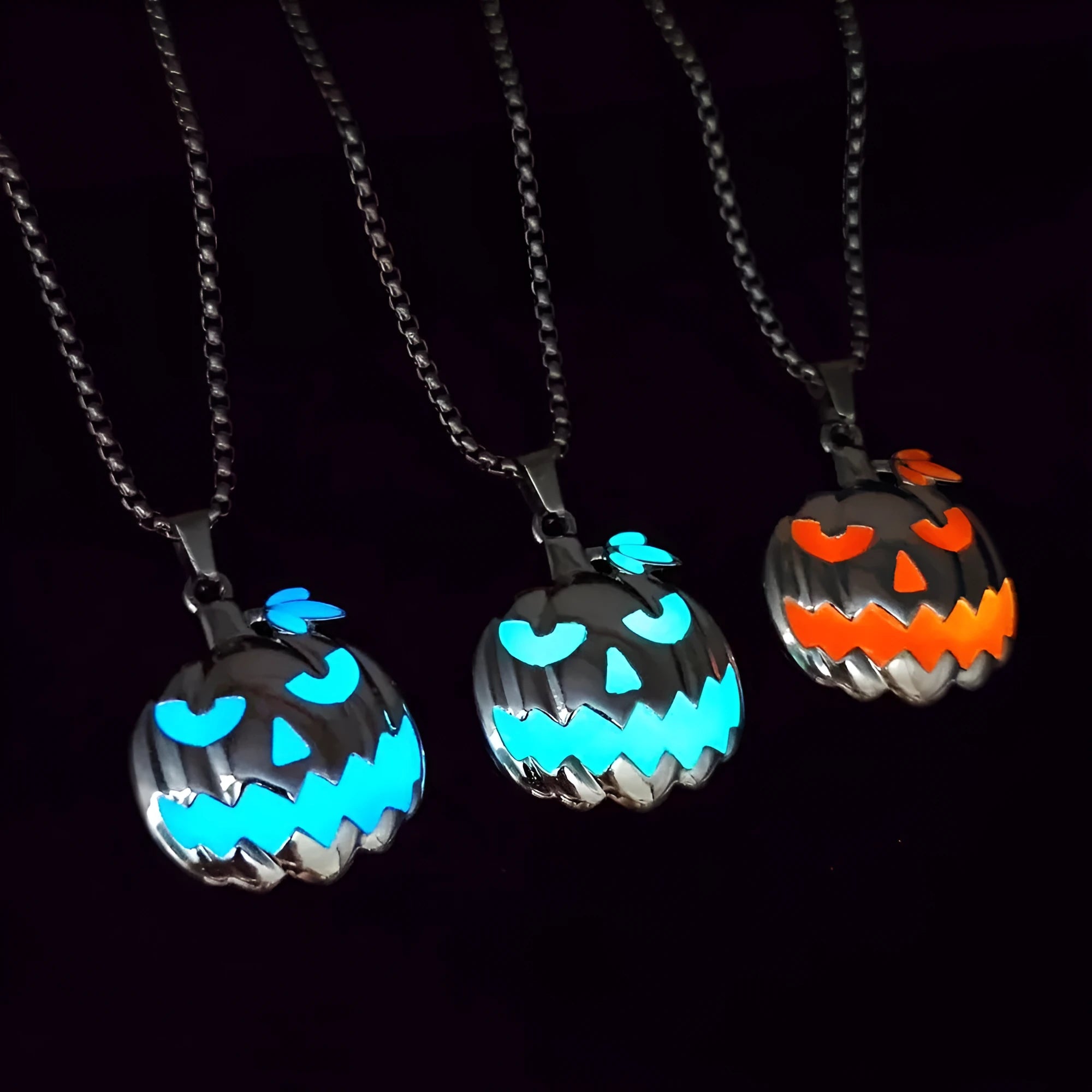 Luminous pumpkin pendant necklace with ghost face design glowing in the dark