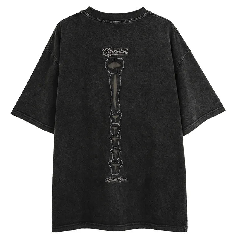 Black cotton T-shirt with a large white skull and letter graphic print, showing loose fit and drop-shoulder sleeves.