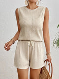 Women's apricot sleeveless vest and matching shorts set laid flat.