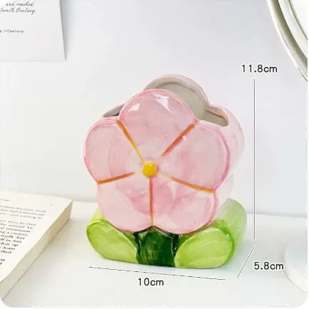 Ceramic desktop pen holder box with floral design in blue, pink, or purple.