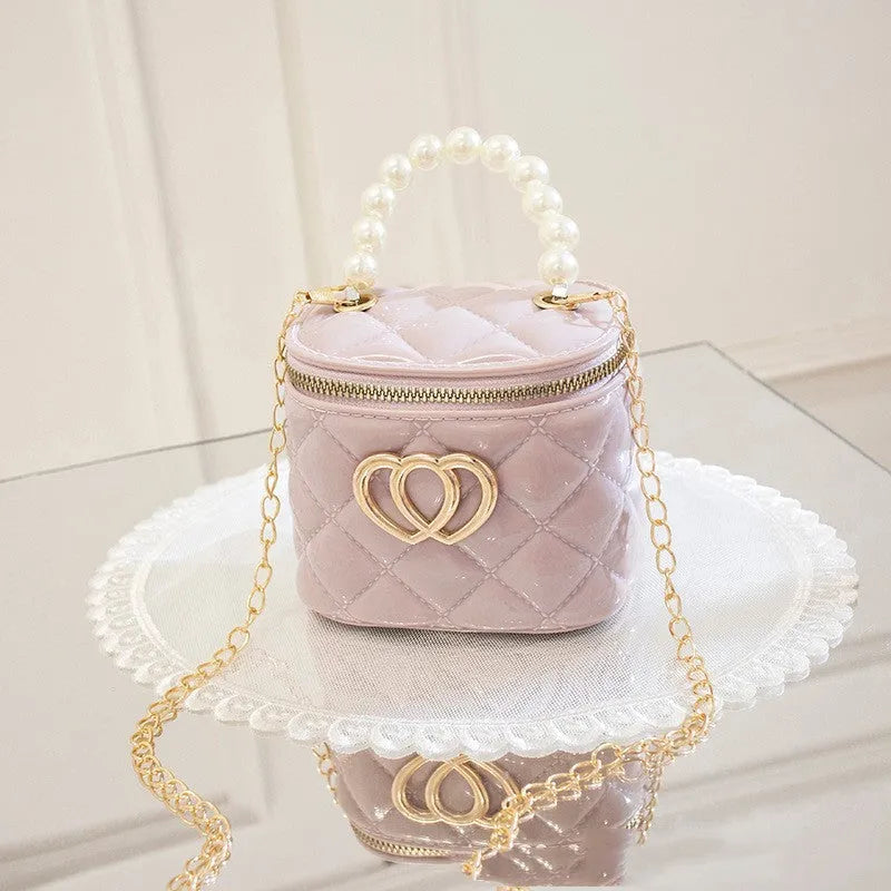 White PVC bucket handbag with a heart-shaped pattern