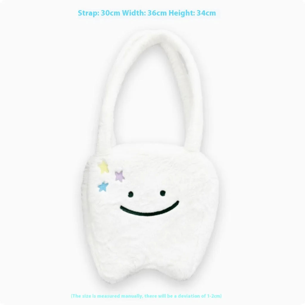 White large tote bag with plush large tooth shoulder strap and cute teeth design