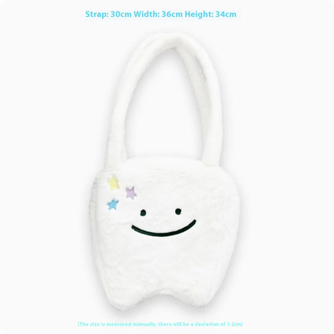 White large tote bag with plush large tooth shoulder strap and cute teeth design